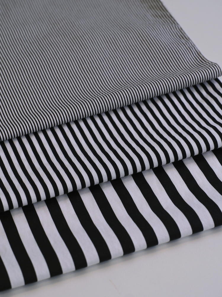 Striped fabric swatches in different pattern scales