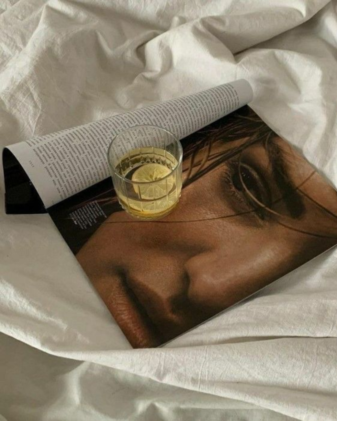 magazine with water glass on it