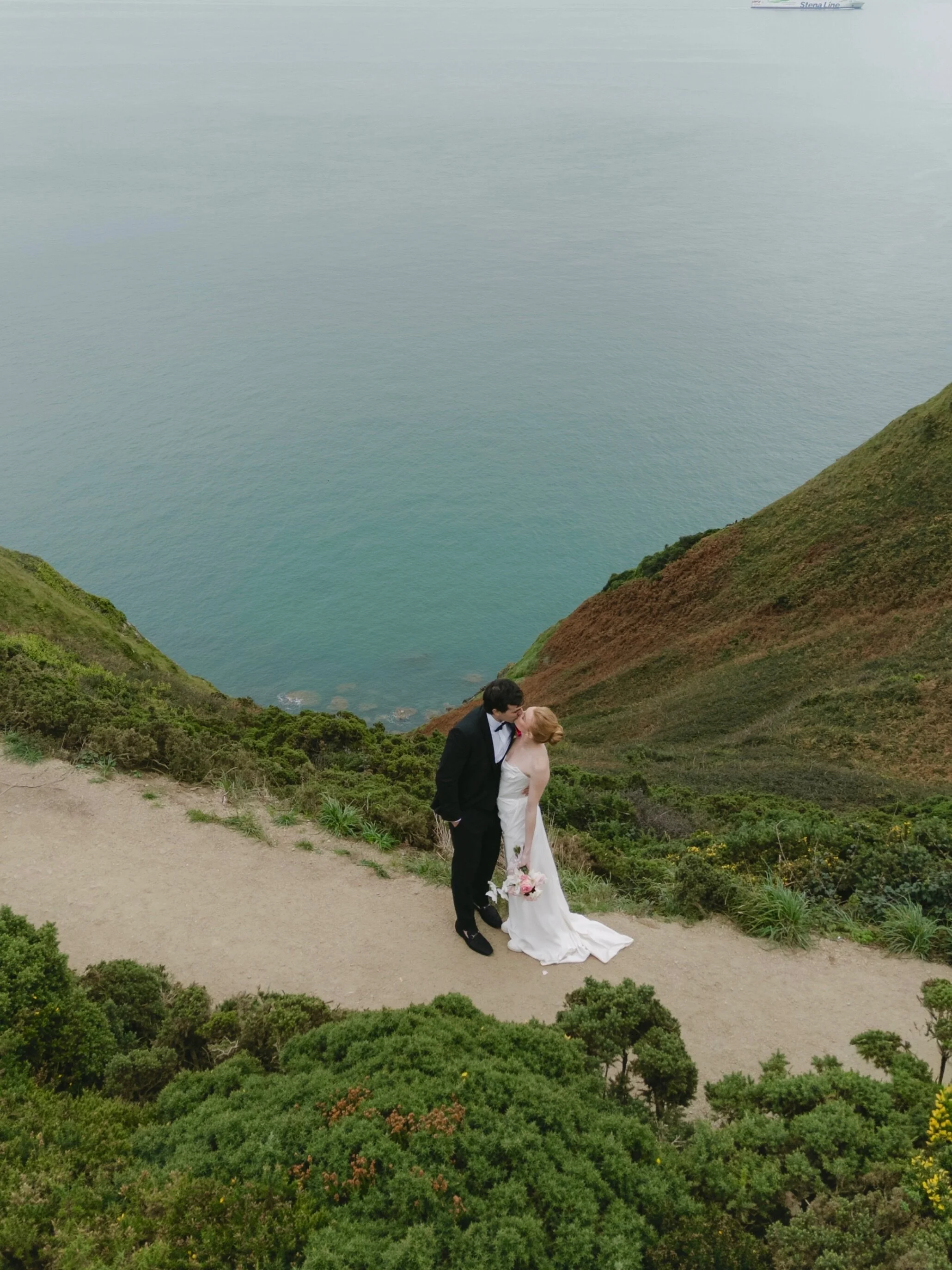 A wedding weekend in Dublin with Olivia &amp; Kevin.
From the timeless elegance of the city to the dramatic cliffs of Howth, every part of this celebration felt deeply personal and full of emotion. The sea, the wind and the Irish landscape created su