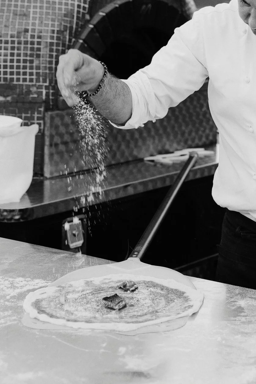 Fresh pizza being prepared during the welcome dinner at Il Borro in Tuscany