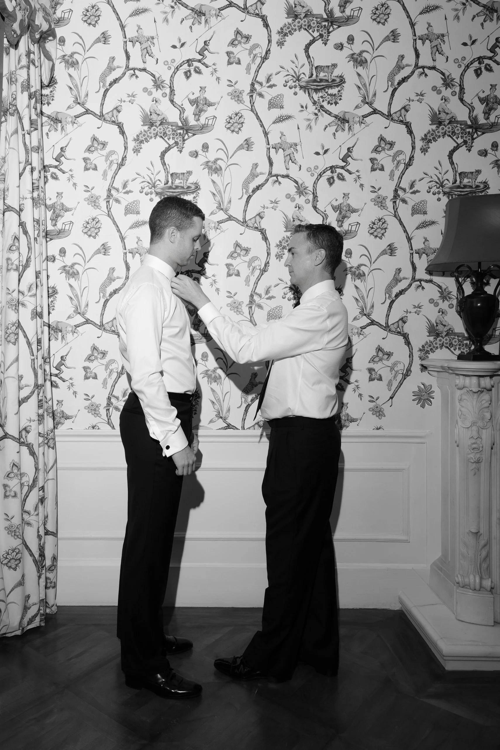 Micah helping Stefan get ready before the ceremony