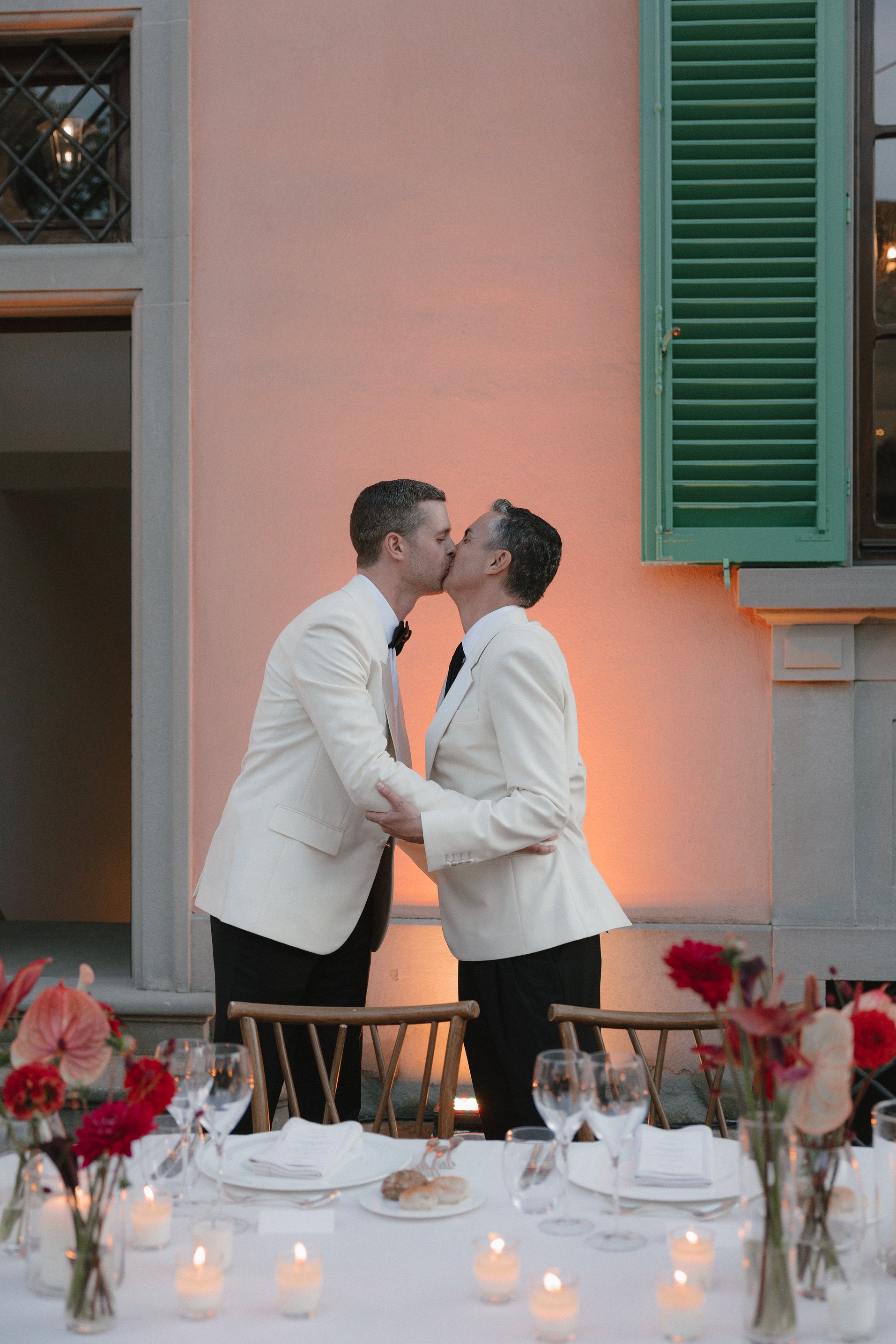 Romantic kiss outside the historic villa at Il Borro
