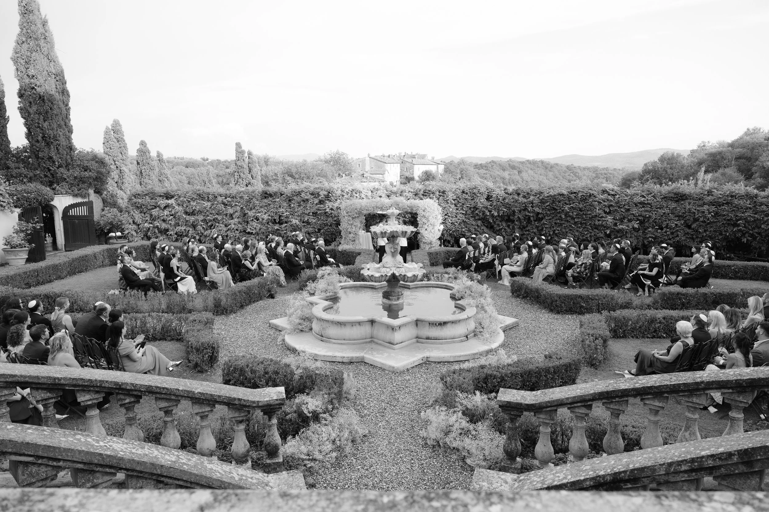 View across the historic gardens during the ceremony at Il Borro