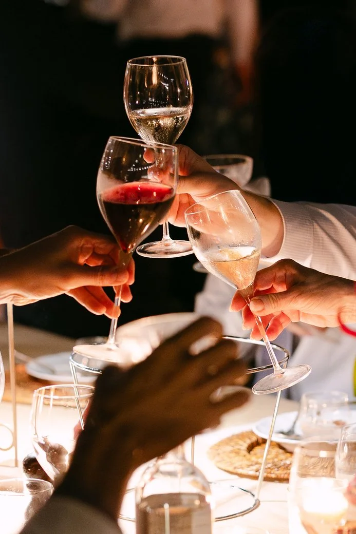 Guests toasting during the welcome dinner at Il Borro