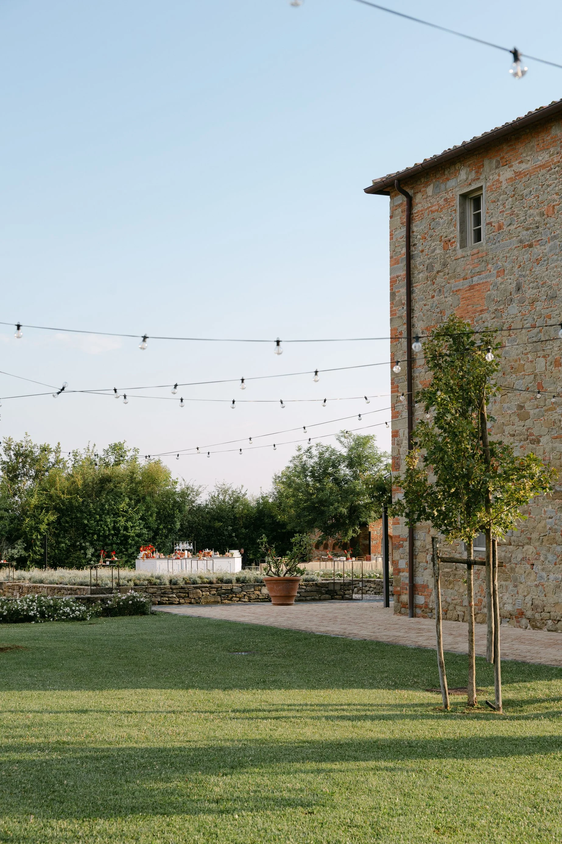 Outdoor reception area at Aia del Borro prepared for a luxury welcome dinner
