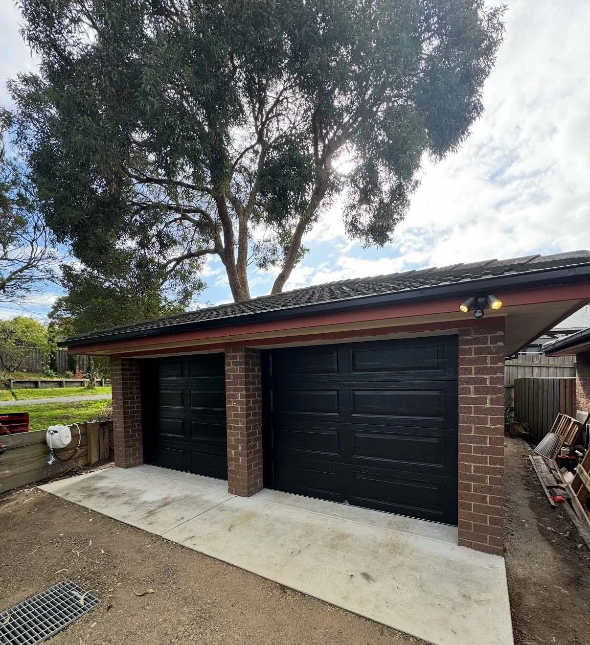 We transformed our clients open carport to a secure, stylish garage 🚗✨ 

This conversion gives our client extra security, protection from the elements, and a fresh new look for their home.