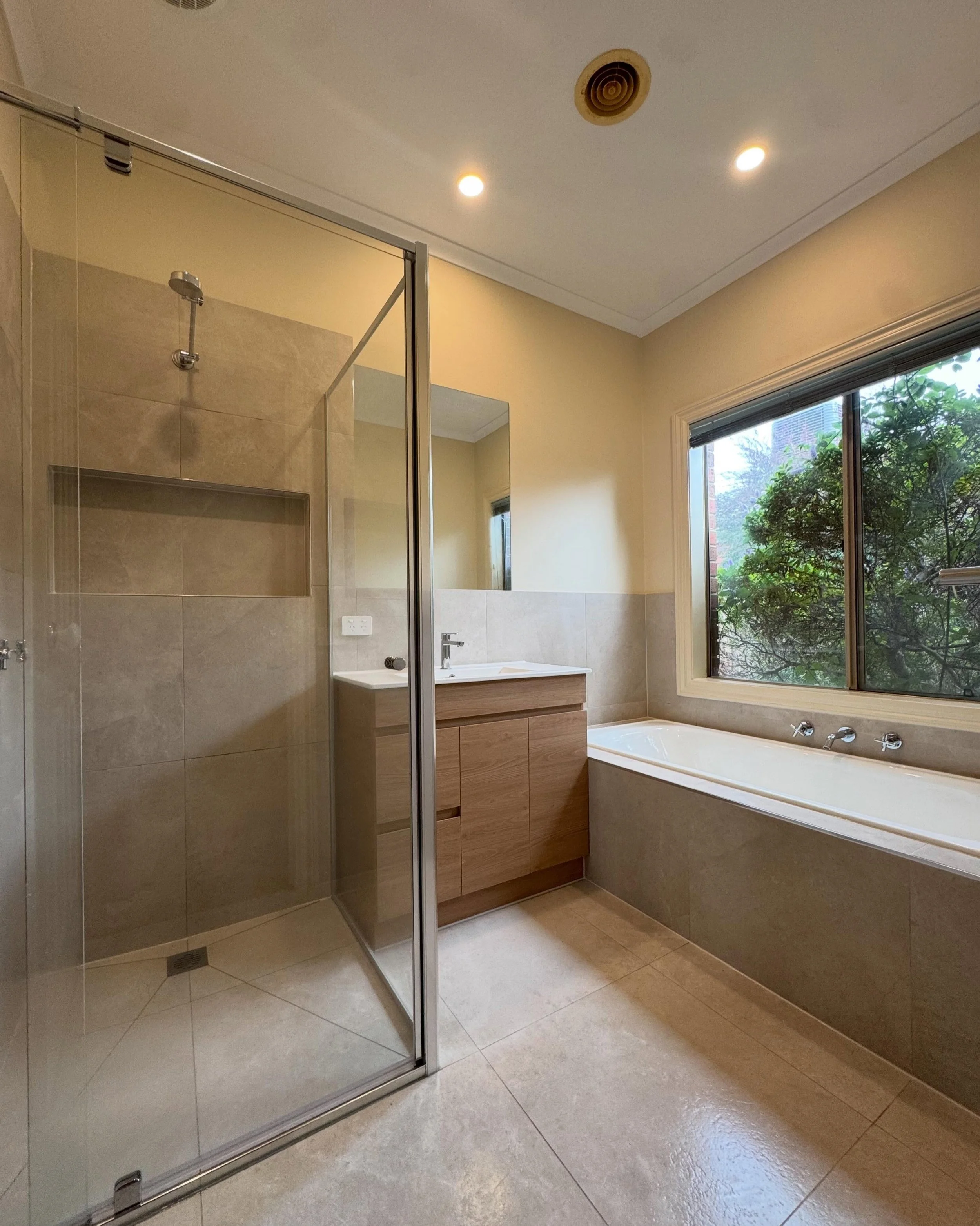 A fresh new bathroom transformation completed in Frankston south 

Featuring warm neutral tones, custom vanity, recessed shower niche and a full-size bath. Every detail was designed to bring a  new modern feel