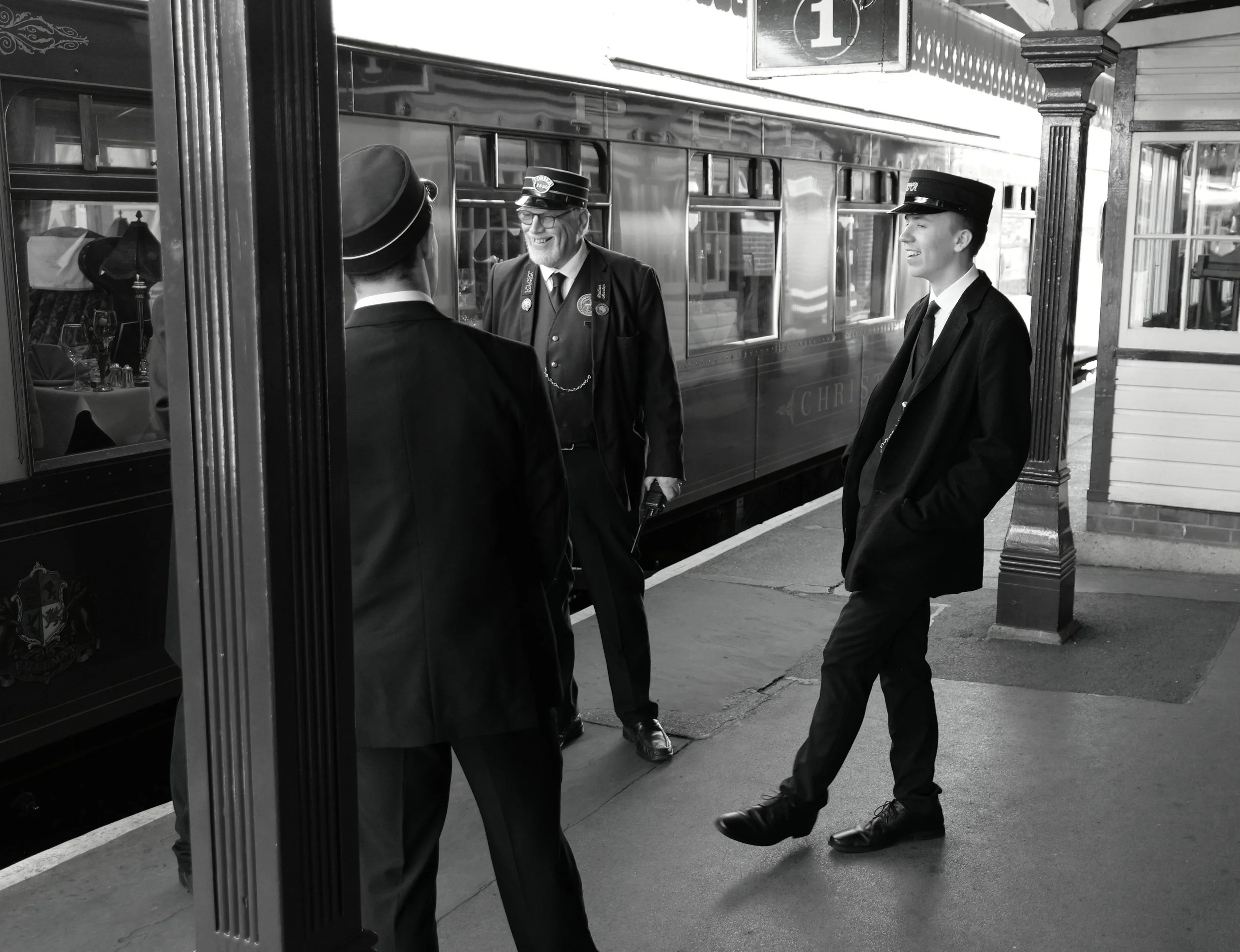 When the scent of oil and coal, drifts upon the platform busy, the masters laugh and chatter, to send you on your way.