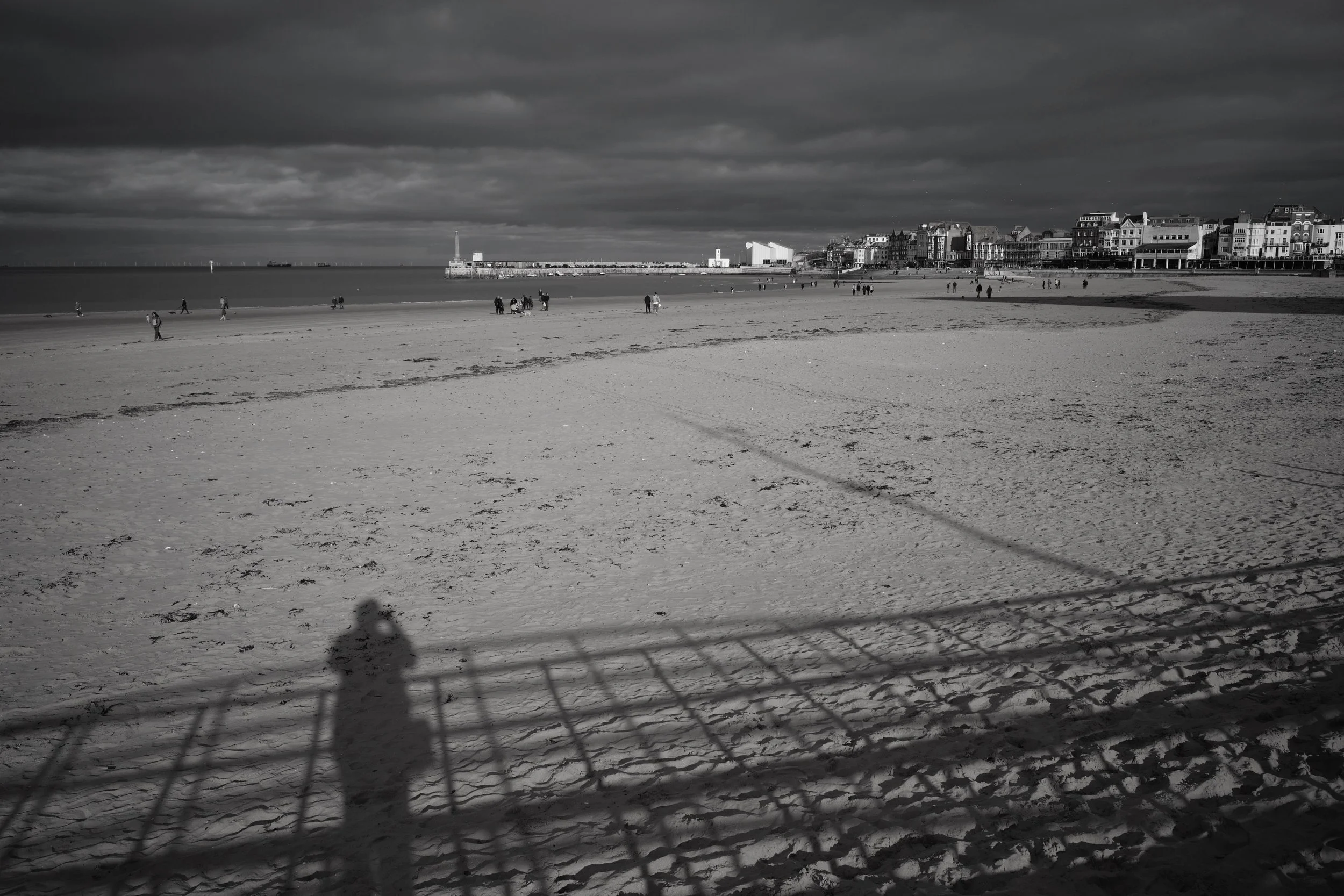 The wanderer reflects upon the sands of time.