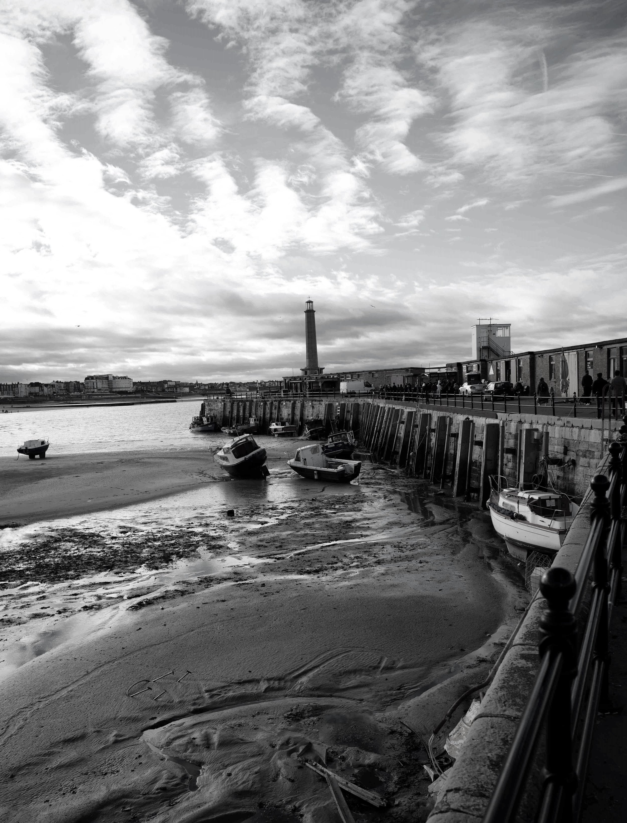 The sea retreats, they rest upon the sand.