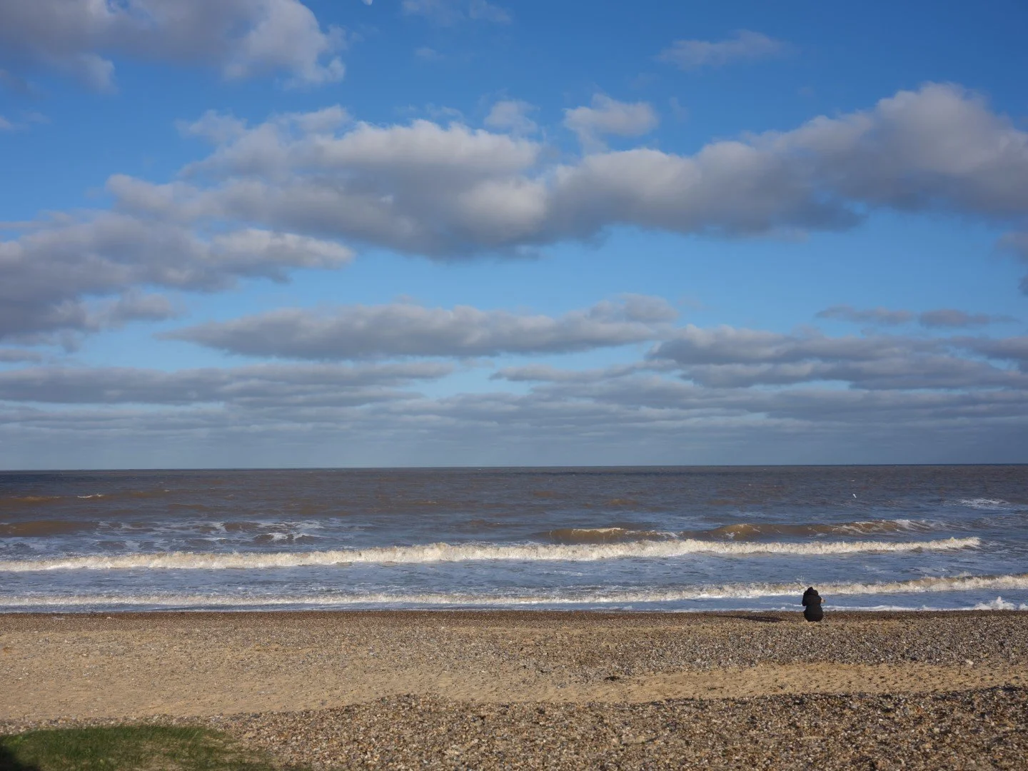 I sit and greet the sky, the last hug of a friend of old.