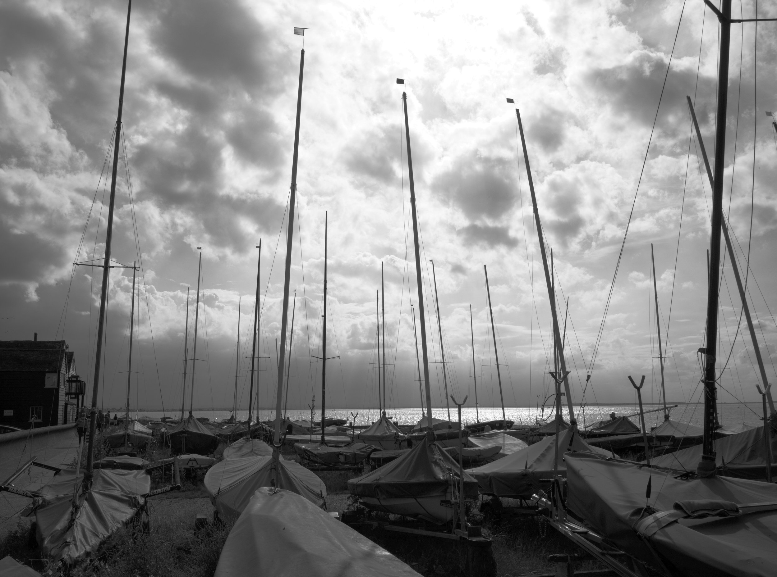 The flapping sounds of winds, they wait and watch the clouds roll by. To yearn and sail upon the waves.