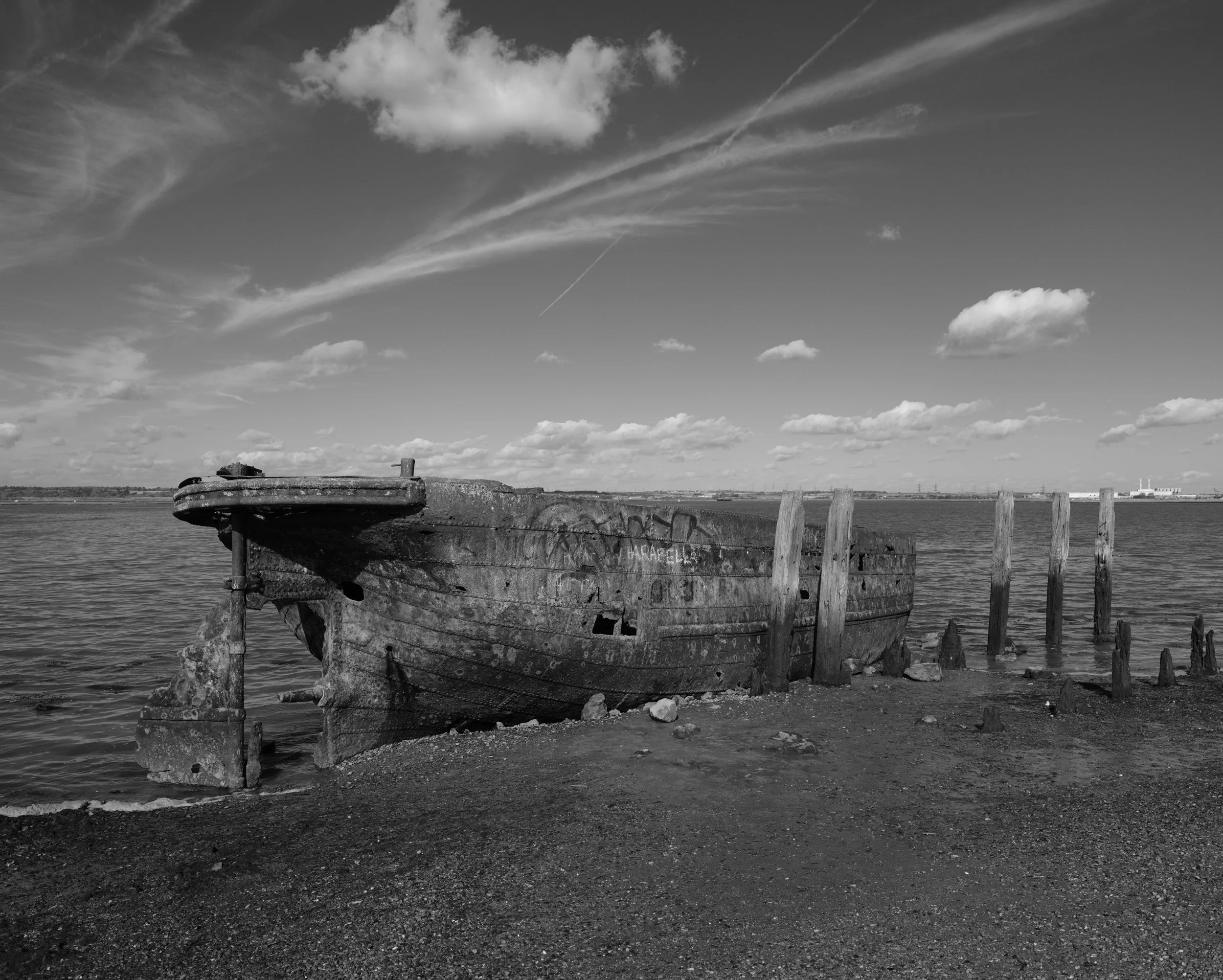 A quiet place, to sit and feel the breeze. She sits at waters lap as tides and time call her to the end