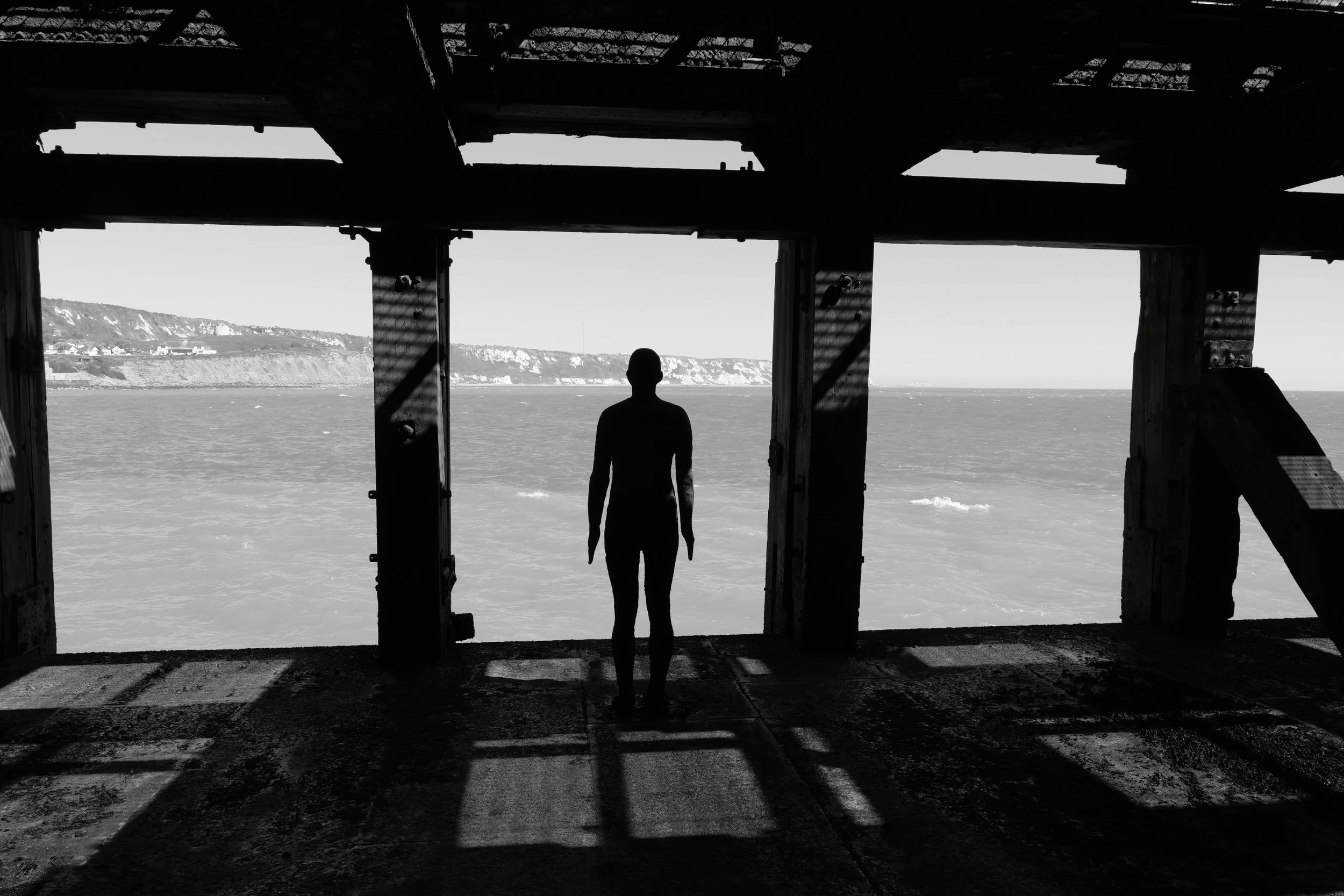 The lonely stare upon the vast, shadows of the mind revealed.