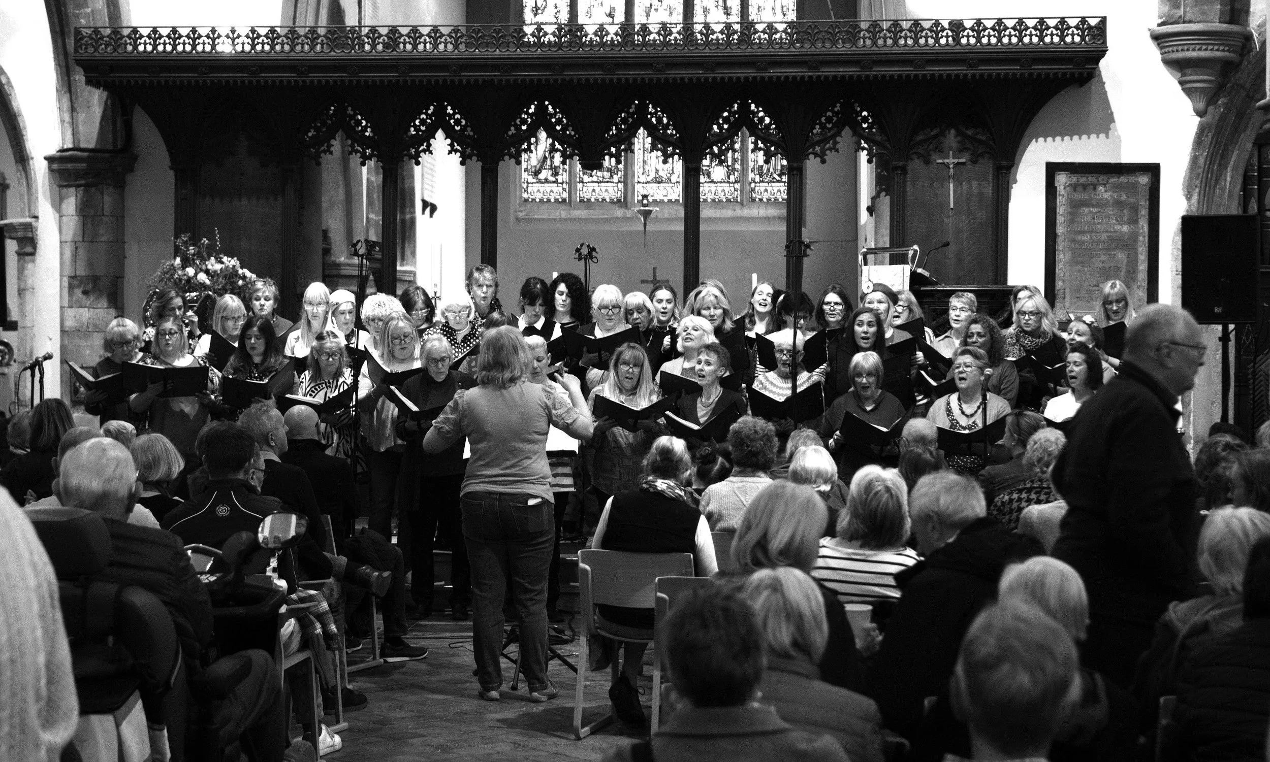 A choir sings, the echoes of distant souls reverb. 