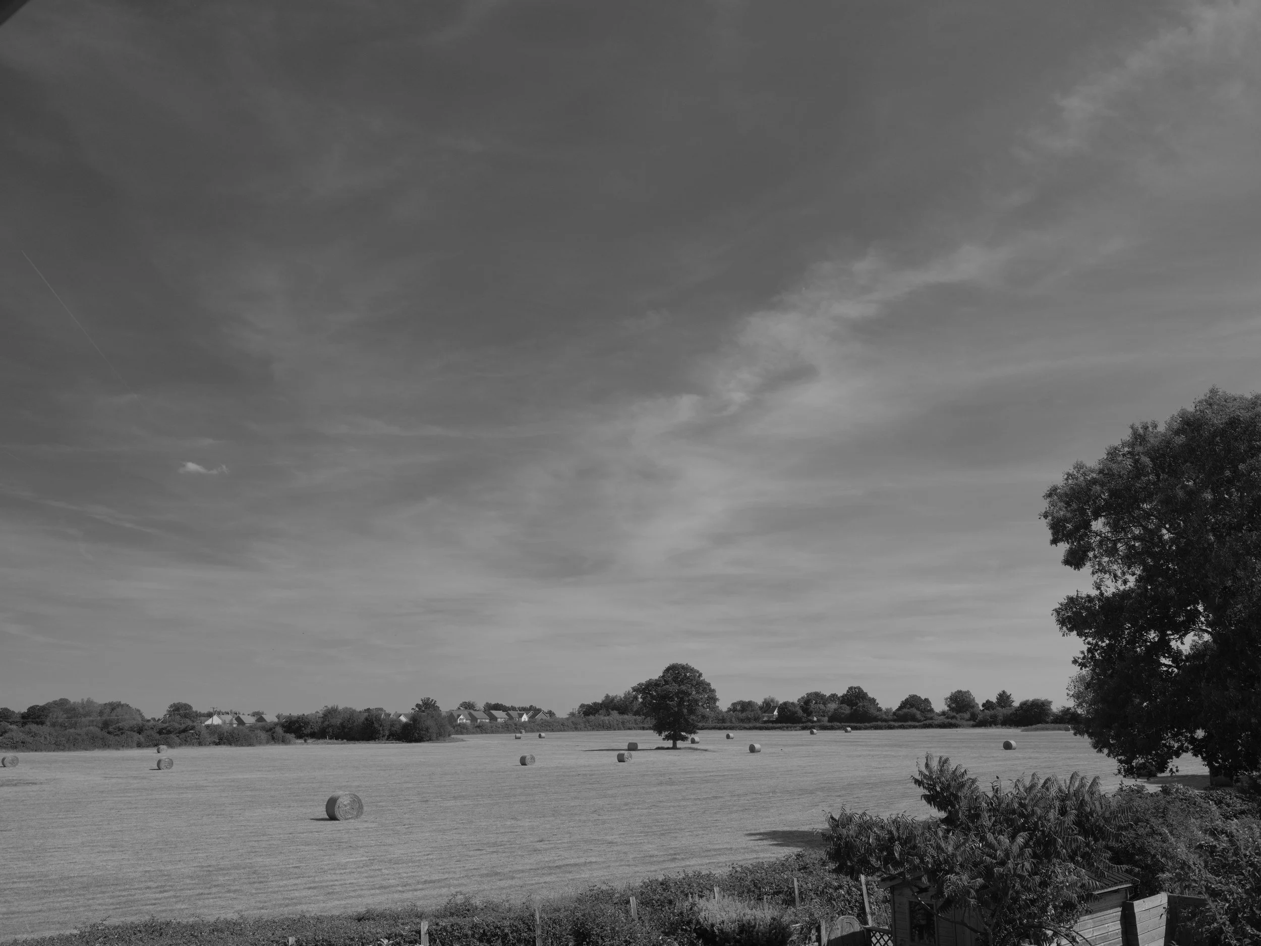 Turners land remains, making hay while sun does shine, the ways of old remain. Summers heat toils the fields as harvest counts the score. A year recoils of natures woes and seeks to grow no more.

