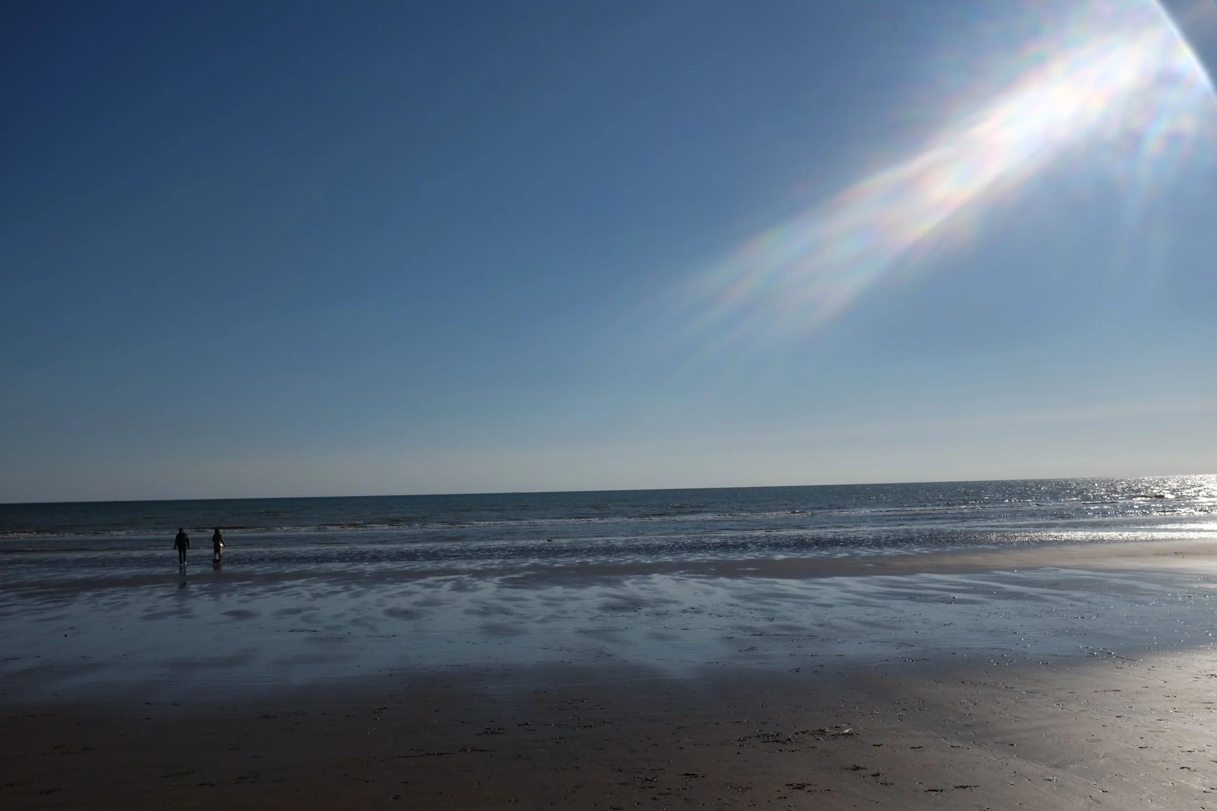 Light falls upon the walkers, the promise shown. 