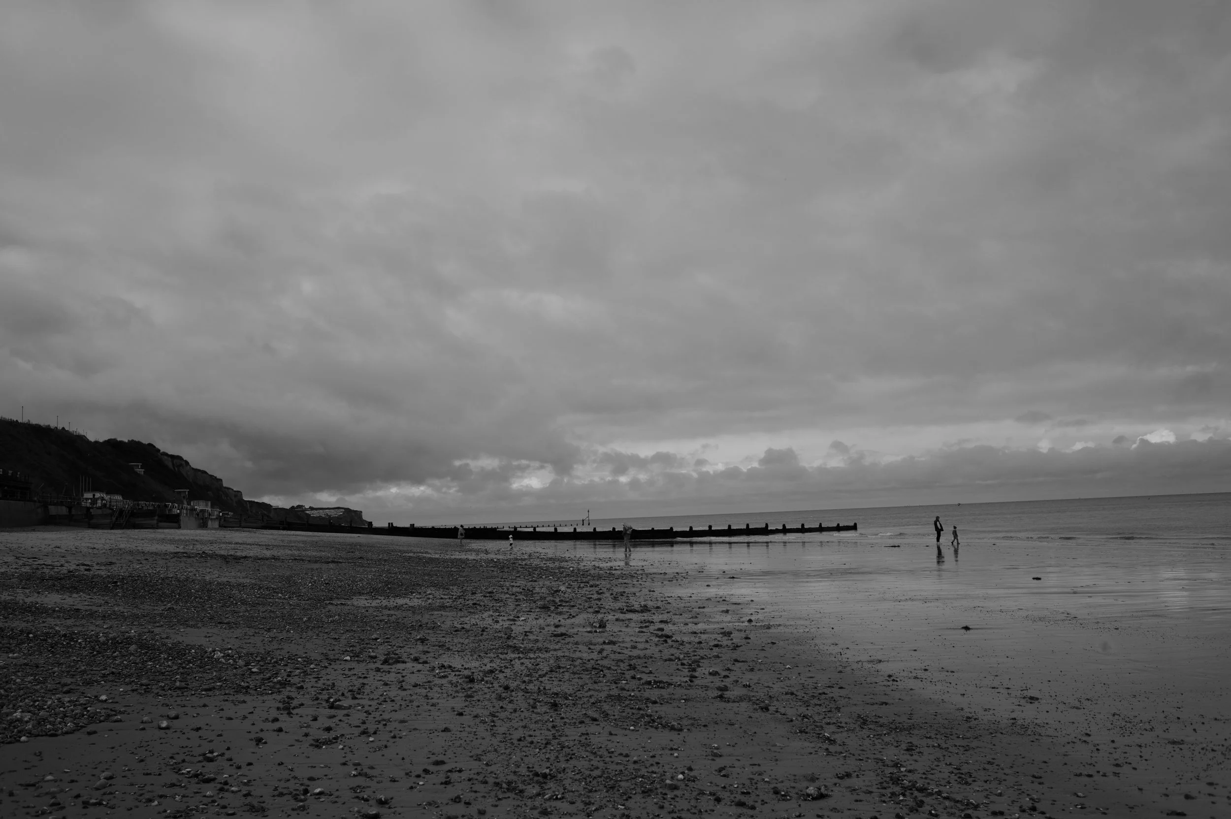 The light fades as breezes drift across thy collar turned.