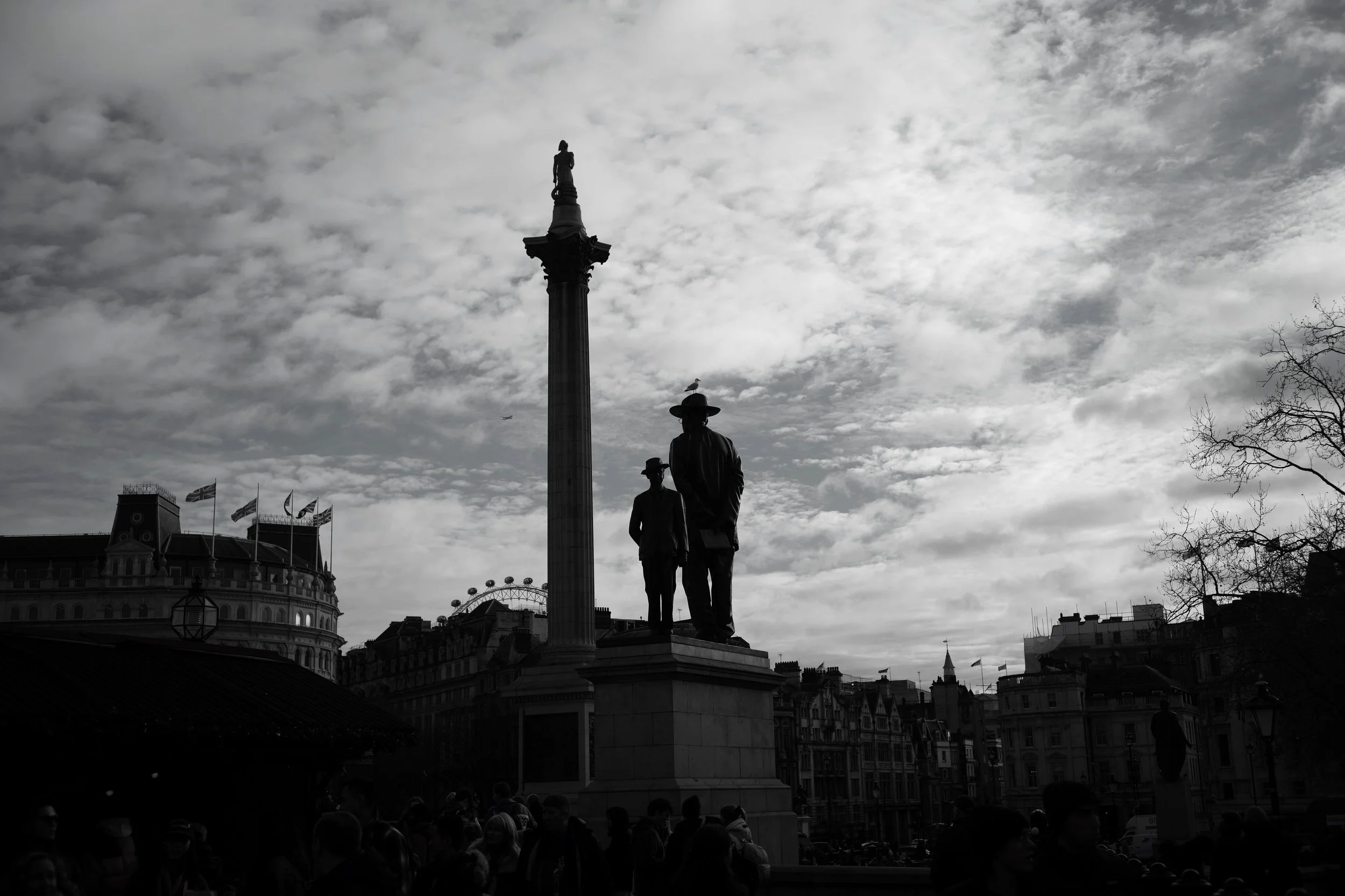 A Christmas sky, the London view. The tuneful tone of carols sung, the gleeful cheer of booze and fun. The dusk brings warmth of friends and kins, a happy time soon a new year brings.