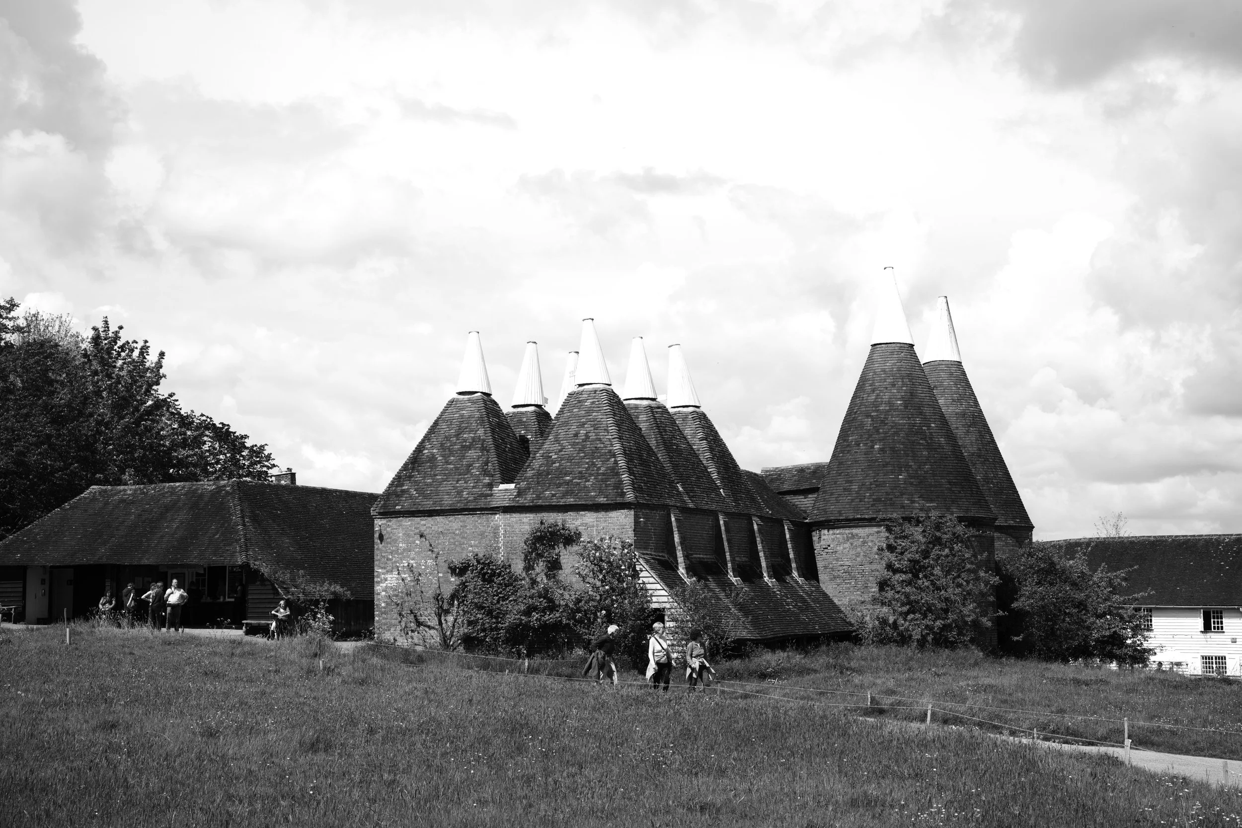 The Oasts of old still proud, a summer breeze awakens.