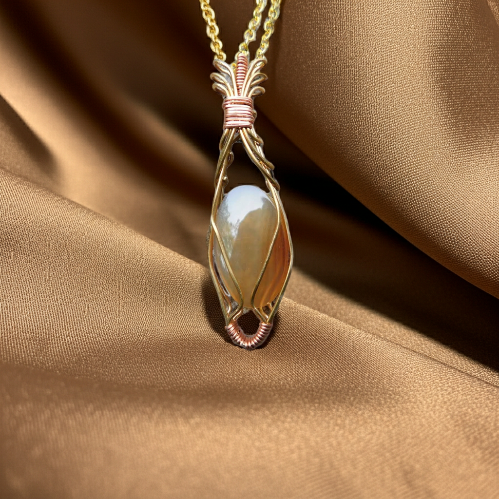 Fire-Agate-Necklace---Wire-Wrapped-in-Gold-and-Copper---Root-Chakra,-Sacral-Chakra,-Solar-Plexus-—-The-Beauty-Way-edited_1.png