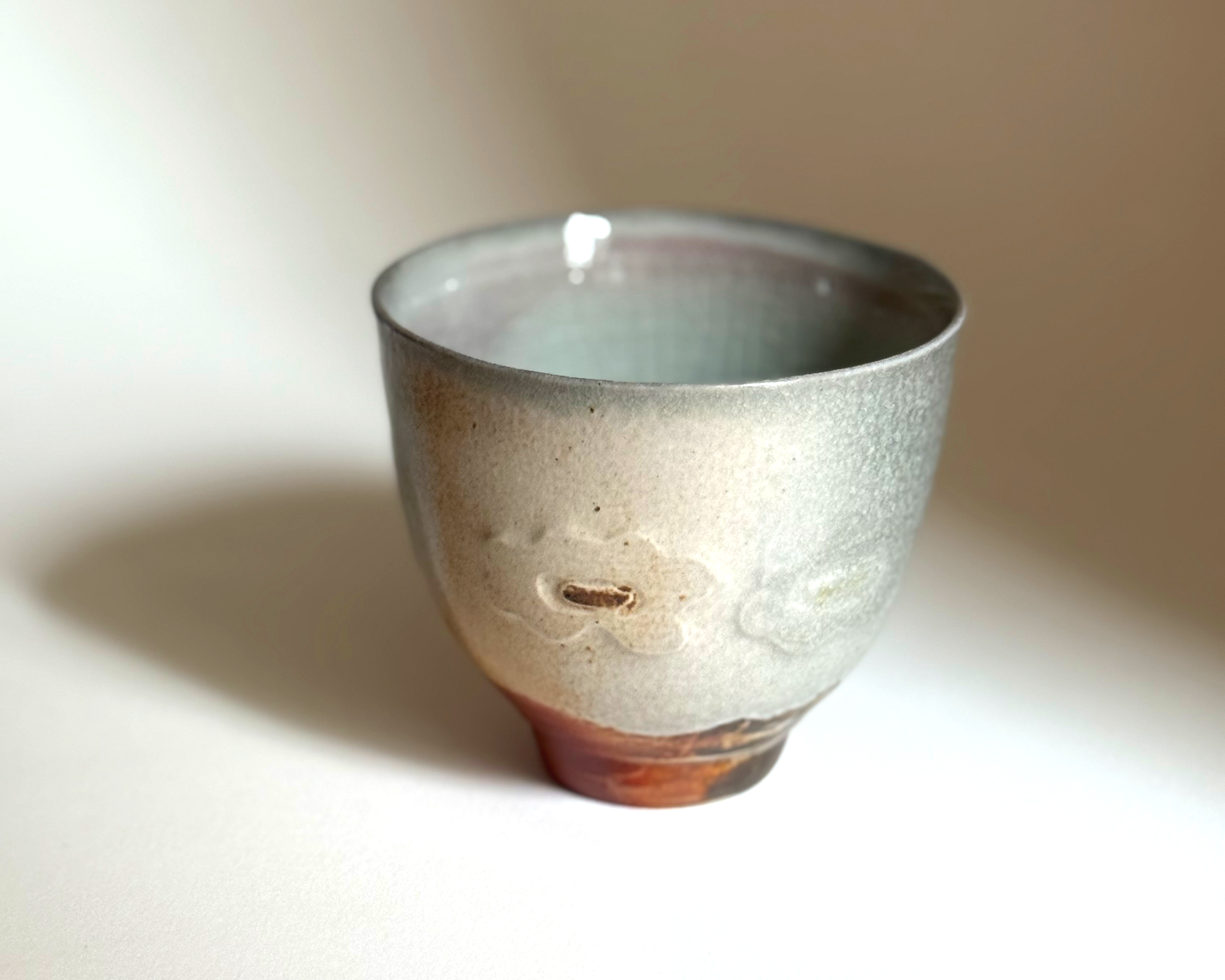 soda fired poppy cup /
stoneware, copper oxide & reactive slip /
3" T x 2.5 W x 2.5 L