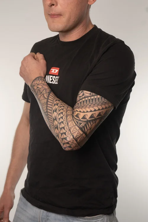 Freehand drawing of Polynesian tattoo onto skin at Skinzophrenic Tattoos Hereford