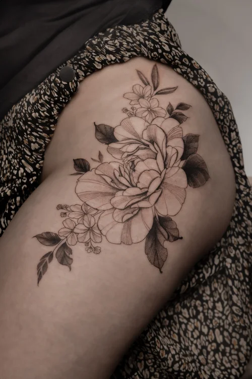 Hip peony tattoo by Anne Marriott