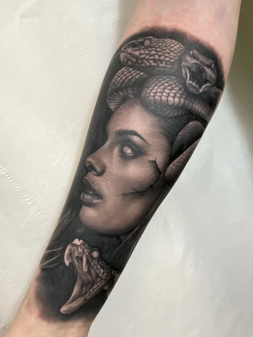 Black and grey realism tattoo by Claudia Santos