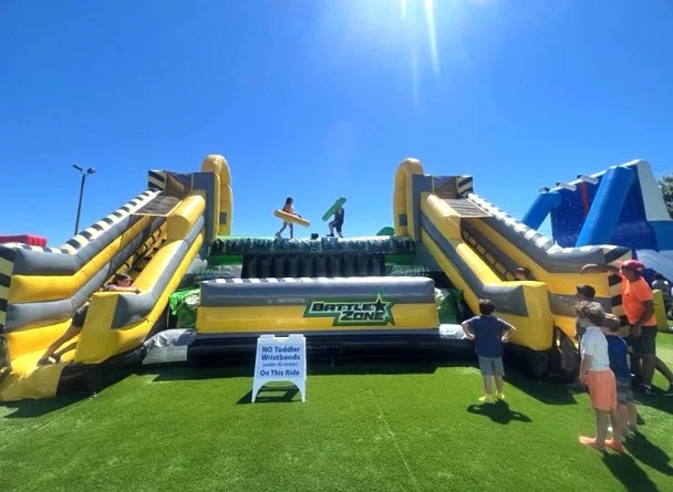 Kids enjoying the inflatable park at the Wicked Waves Water Park in West Yarmouth