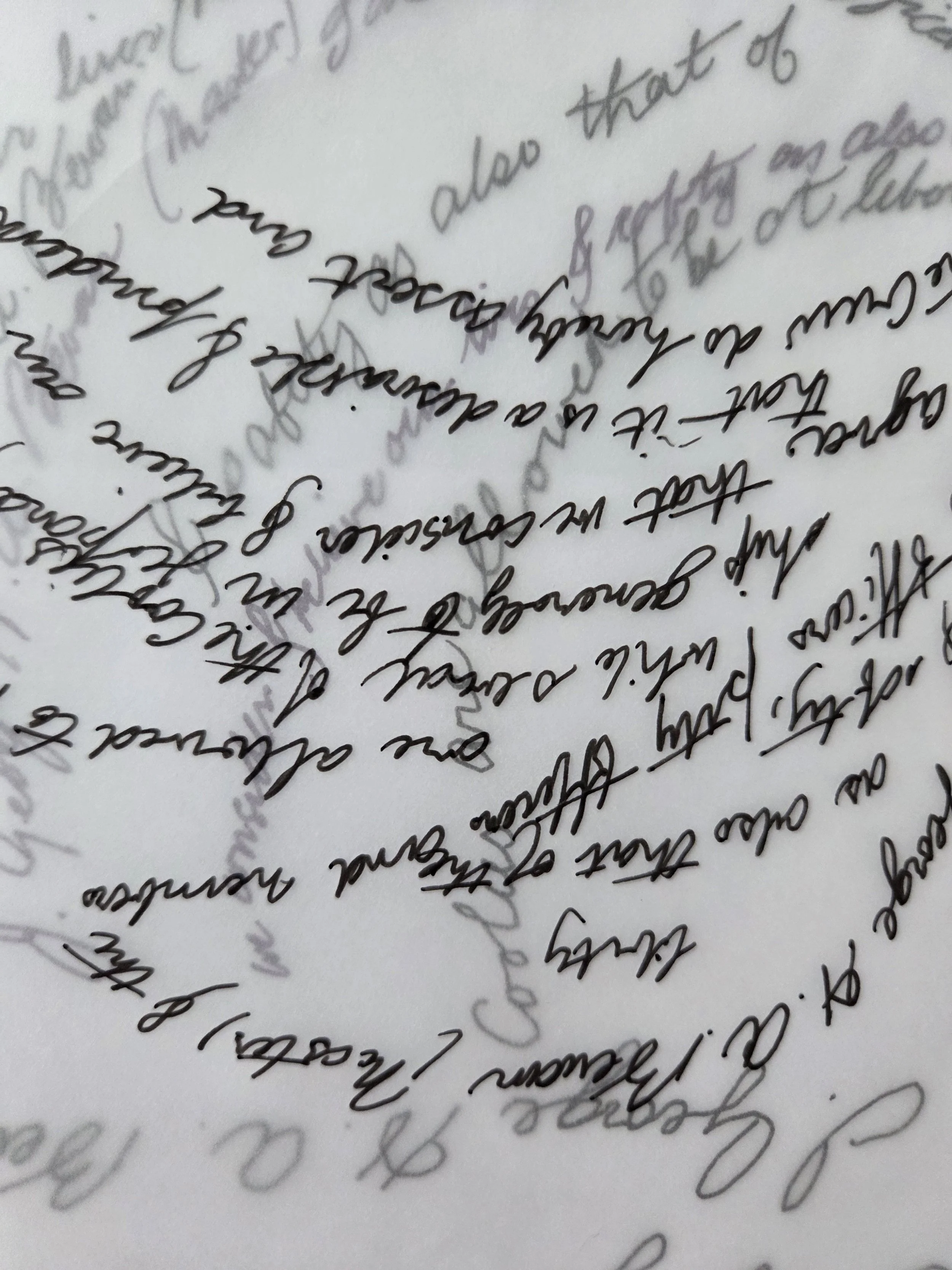 black and white handwriting on tracing paper