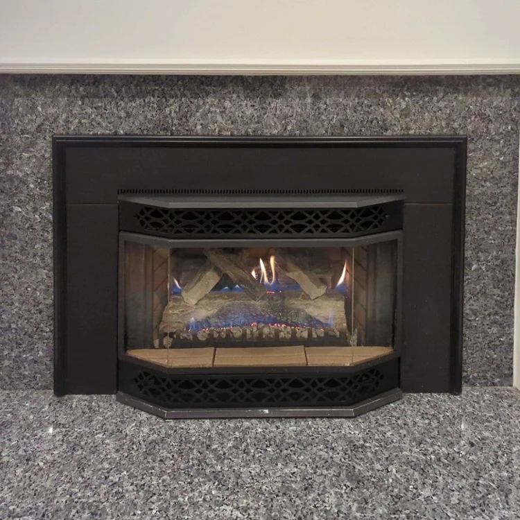 Gas fireplace insert in a granite surround, after cleaning