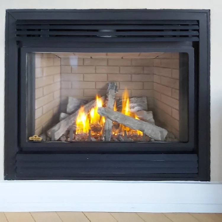 Gas fireplace in a beige wall, after cleaning