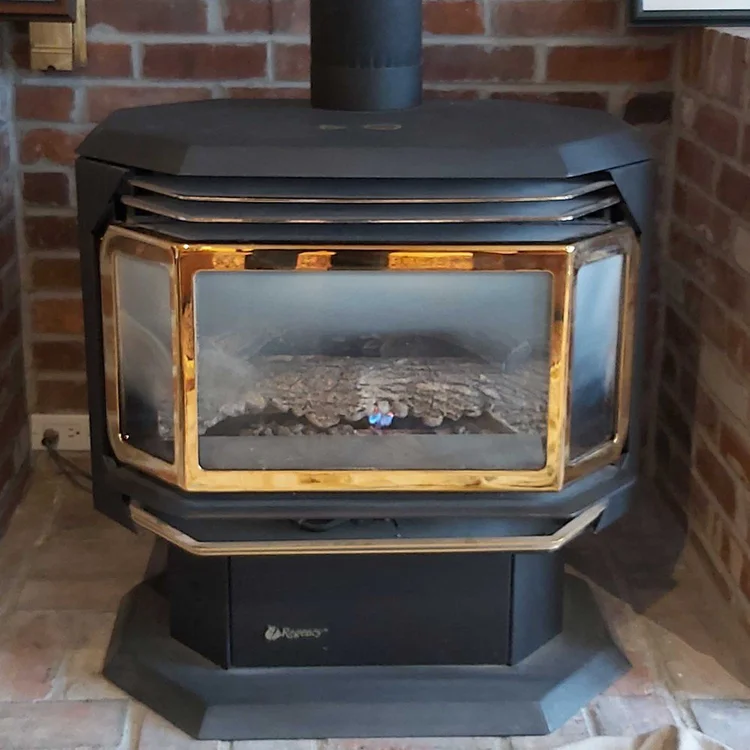Regency gas stove in a brick alcove, before cleaning