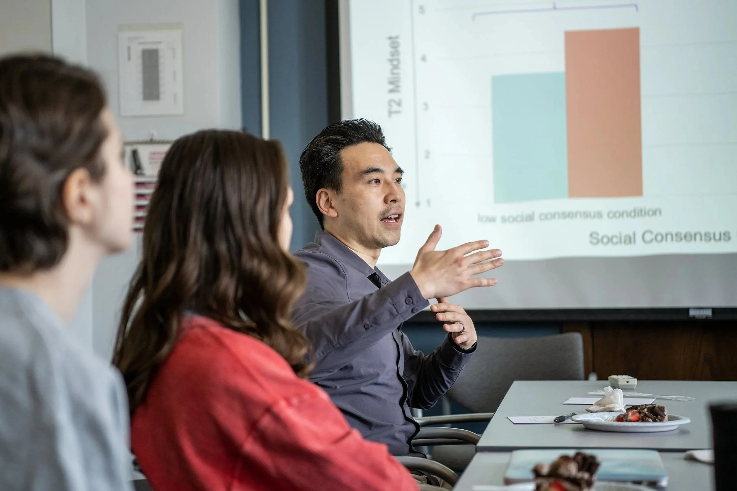 Man giving presentation sitting