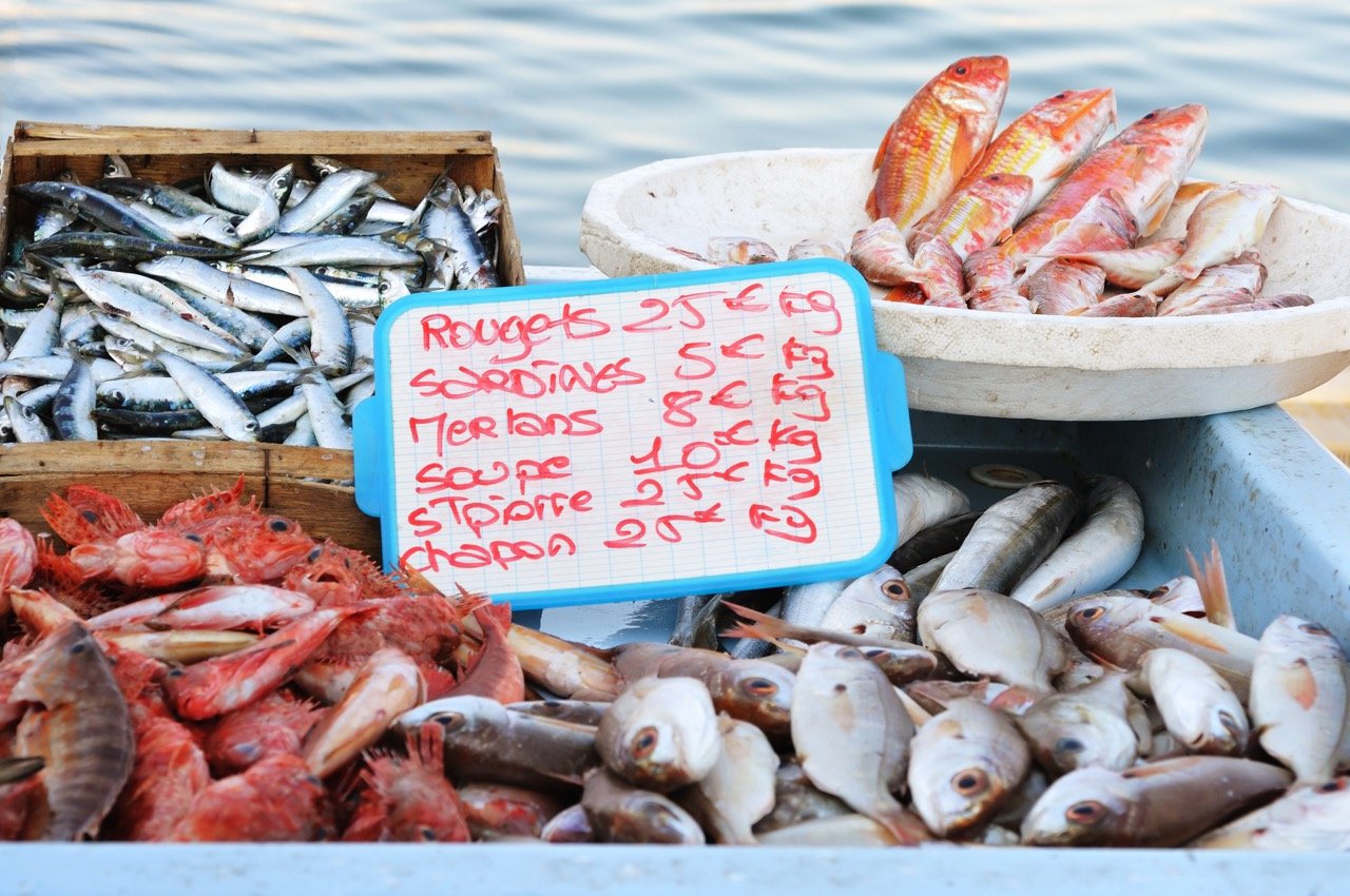  Gather bouillabaisse ingredients at the fish markets along the Old Port of Marseille 