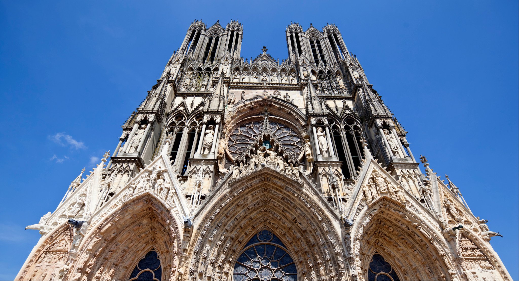   Studying the facade of Notre Dame de Reims Cathedral, a UNESCO Heritage Site  