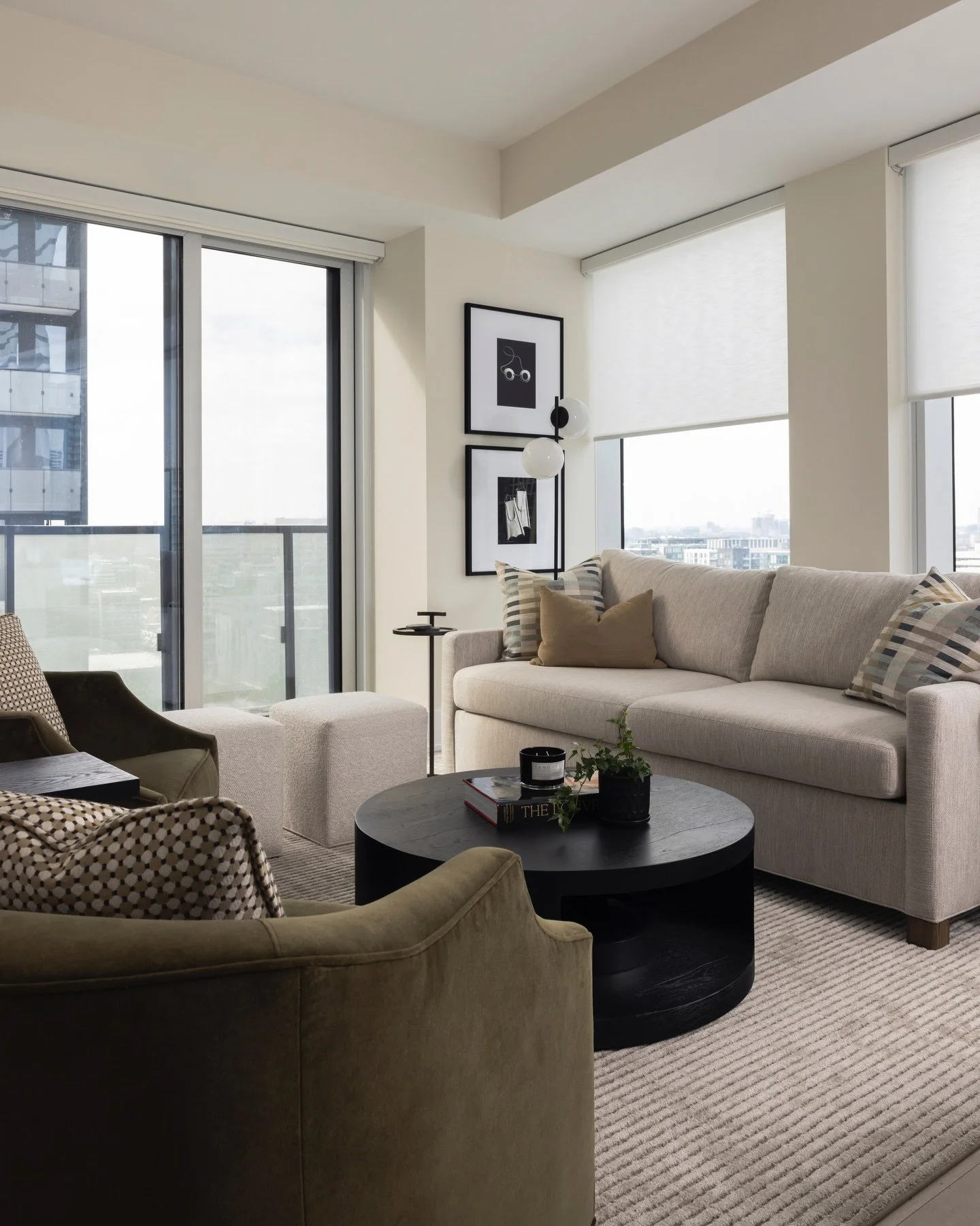 Compact, curated, and unmistakably cool in the heart of the city. The living room here at our Front St Project is functional stylish living space perched way up high in this chic downtown condo.

📸 @kerri.torrey | Design @karinkolbinteriors 
| Proje