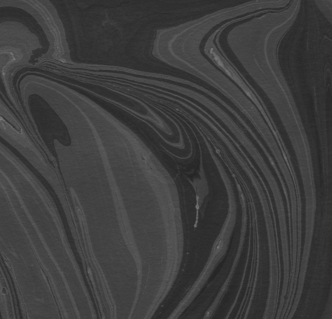 A black swirl background.