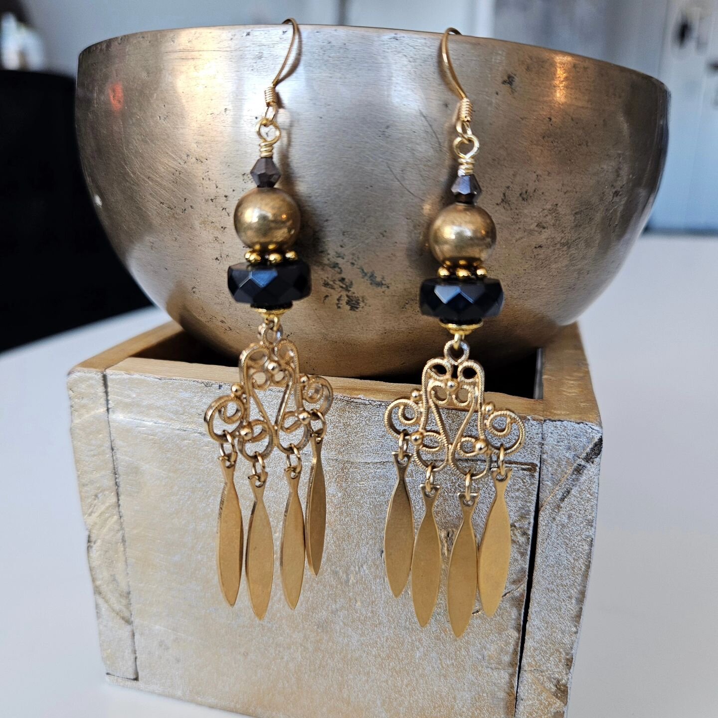 Made this pair for my hairstylist @lela__riccikapricci. She was so kind in offering to put my business cards at her station. You know I had to make her a custom pair!

Repurposed chandelier dangle earrings I enhanced with a mash up of black and gold 