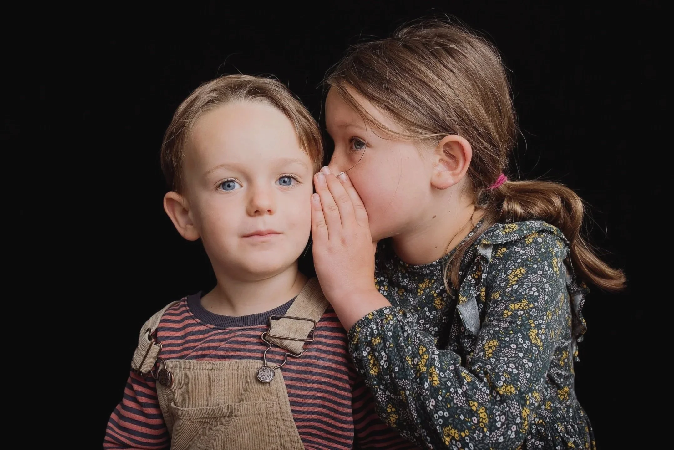 Preschool siblings portrait with clean, simple lighting.