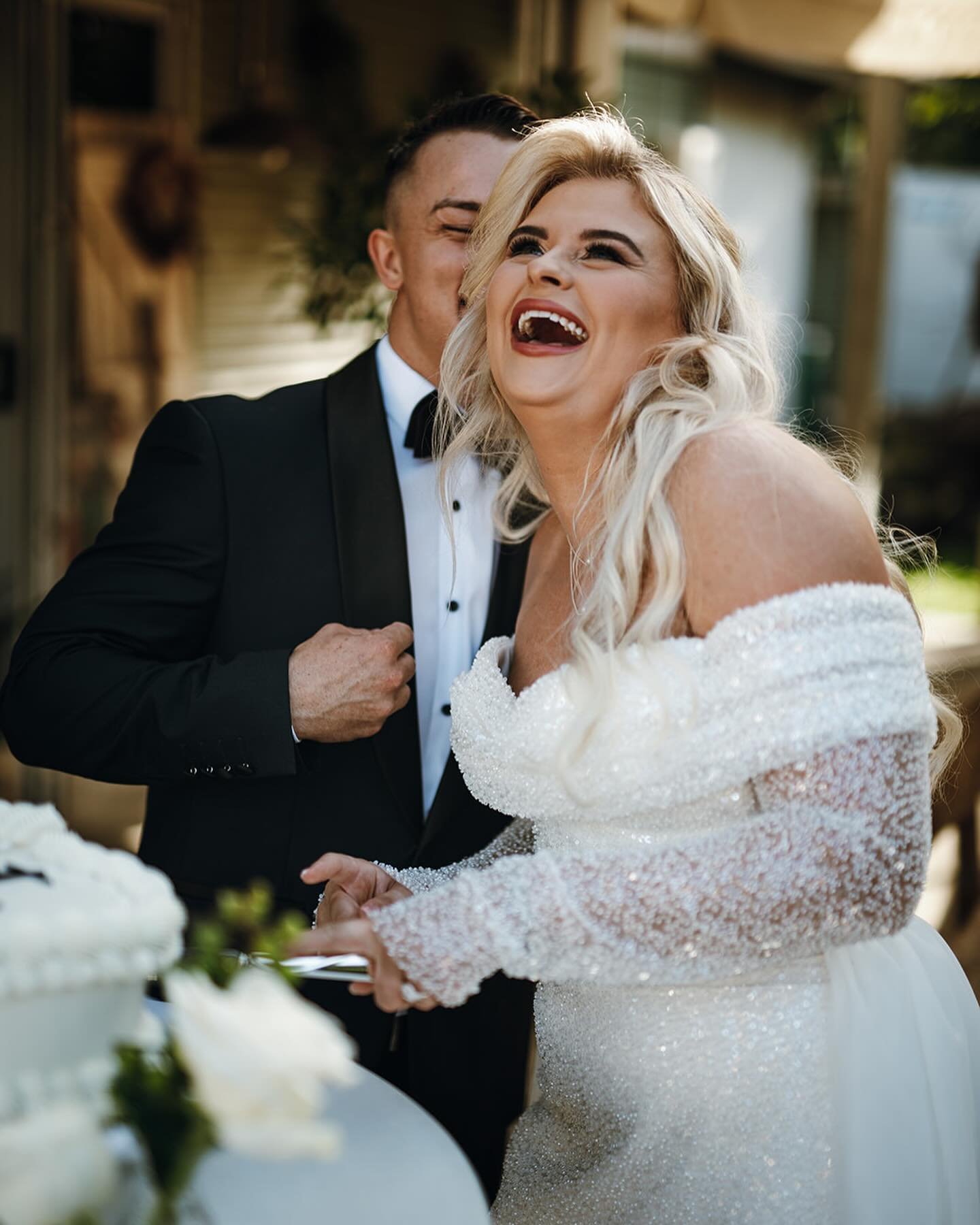 How beautiful does @tahlia__jane look in our sparkling beauty ARETTA by @evalendel? She&rsquo;s bringing the GLAM winter wedding vibes with her romantic off-shoulder neckline and sheer sleeves, and her entire mermaid silhouette is adorned with beadin