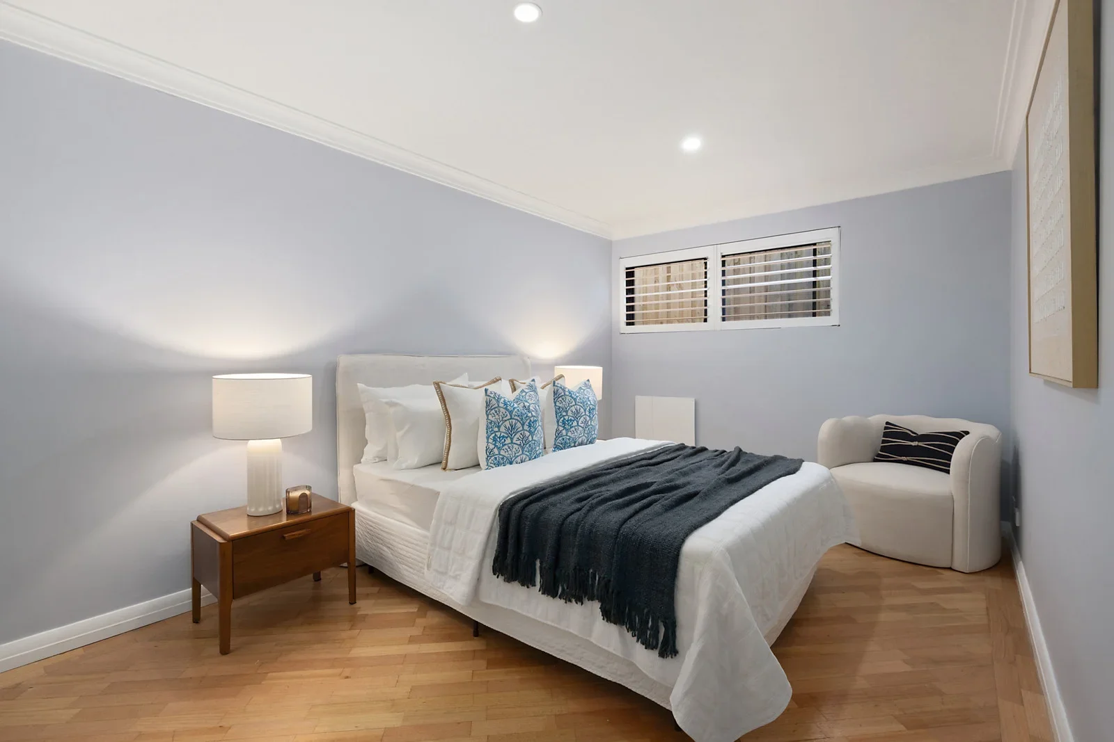 Bedroom styled for sale with layered navy and white bedding, Clontarf