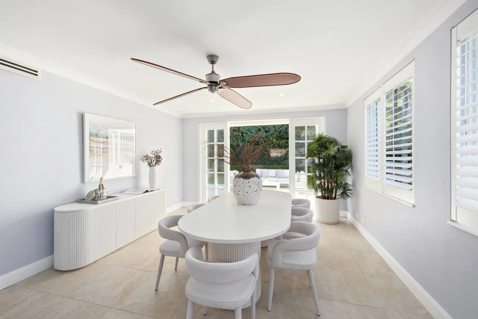 Dining room styled for sale with an oval table and fluted sideboard, Clontarf