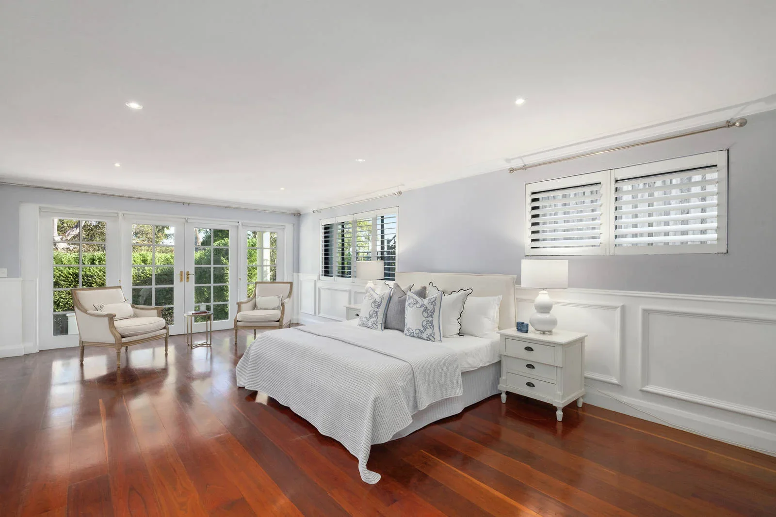 Bedroom styled for sale with timber floors and doors to the garden, Clontarf