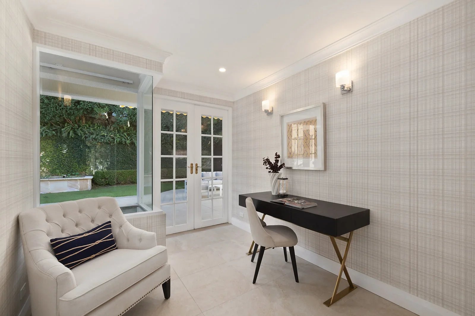 Study styled for sale with a writing desk and armchair beside the garden doors, Clontarf