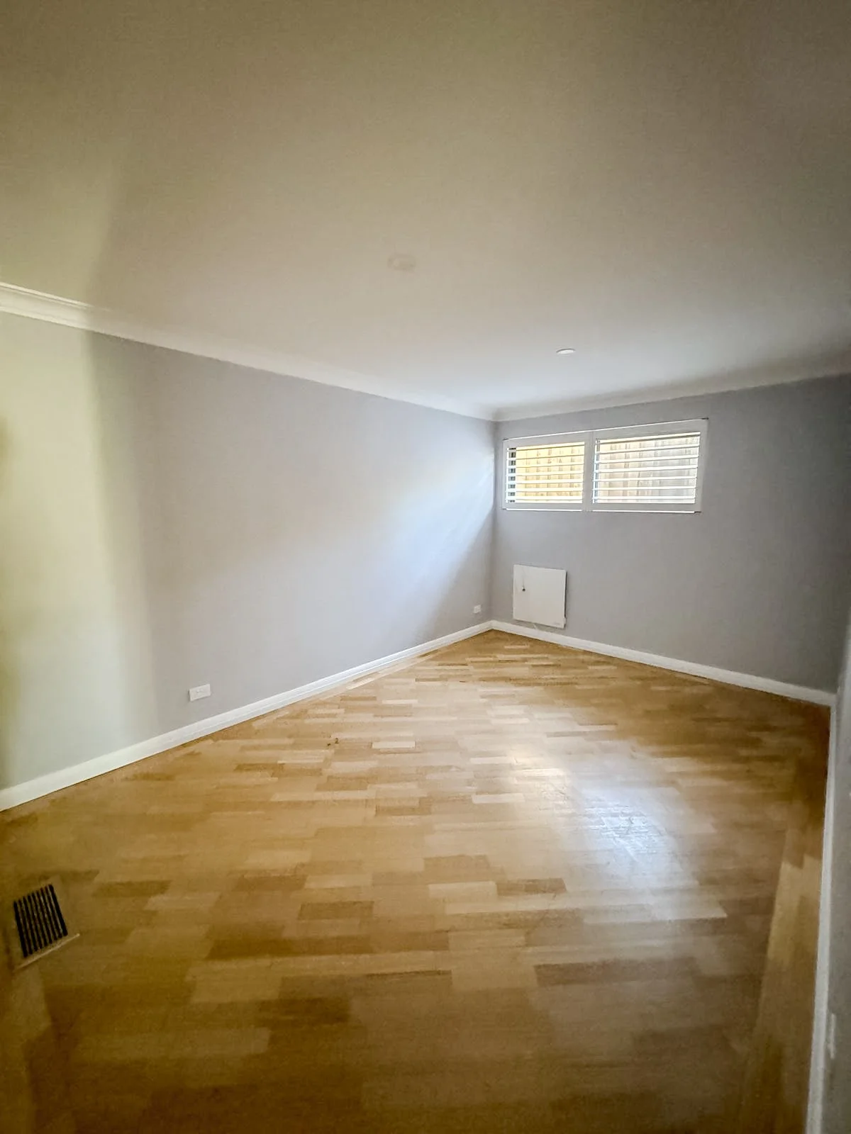 Before styling: empty bedroom with timber floors, Clontarf