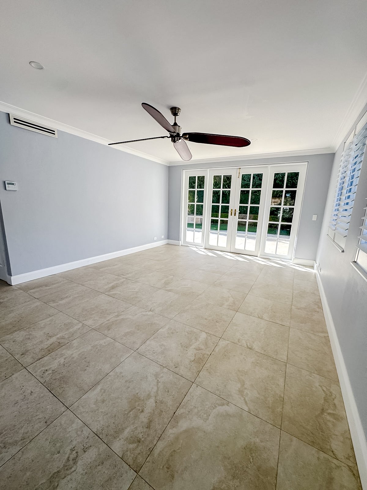 Before styling: empty dining room with doors to the garden, Clontarf