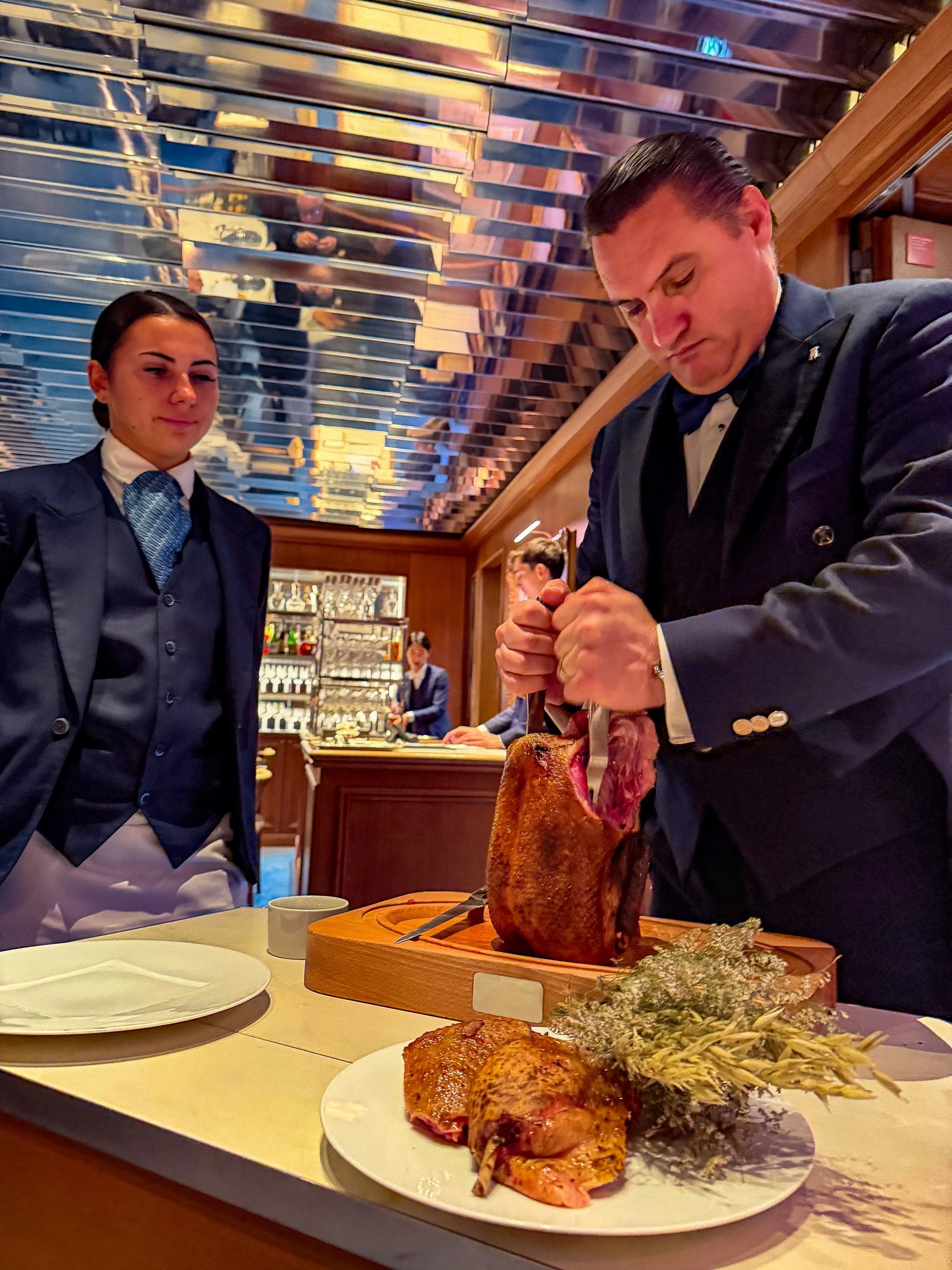 Preparing the duck table side.