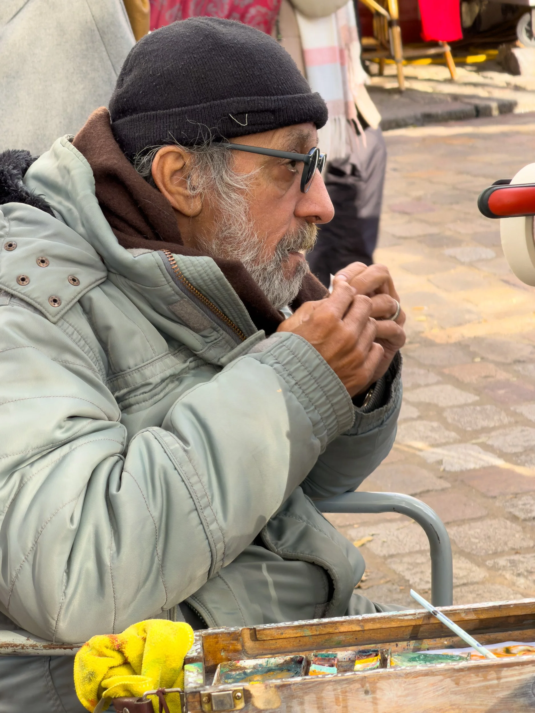 Place du Tertre artist rolling his own.